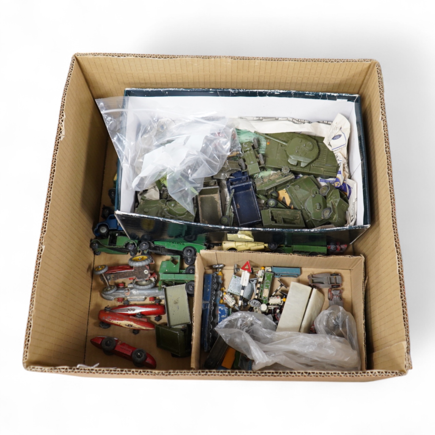 Forty-four 1950s/60s Dinky Toys, etc. including thirty-two commercial vehicles, public transport vehicles, etc. including; market gardener’s wagons, petrol wagons, double deck buses, a Bedford tipper, racing cars, a mech